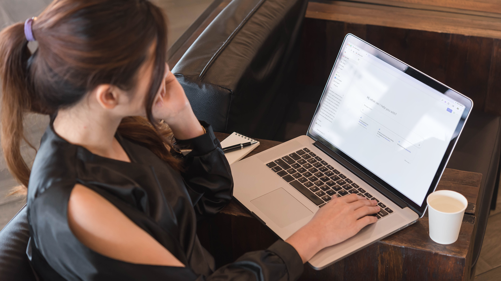 Student at a coffee shop using Copilot Chat